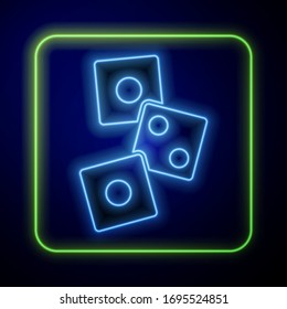 Glowing neon Game dice icon isolated on blue background. Casino gambling.  Vector Illustration