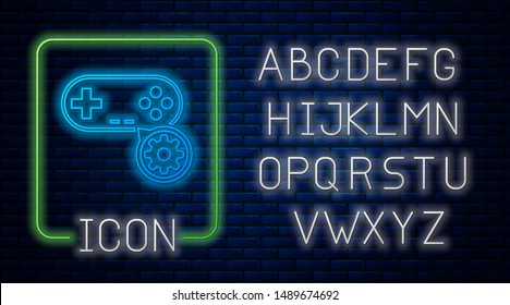 Glowing neon Gamepad and gear icon isolated on brick wall background. Adjusting app, service concept, setting options, maintenance, repair, fixing. Neon light alphabet. Vector Illustration