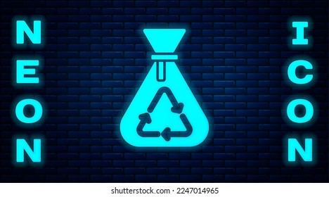 Glowing neon Garbage bag with recycle symbol icon isolated on brick wall background. Trash can icon. Recycle basket sign.  Vector
