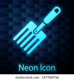 Glowing neon Garden fork icon isolated on brick wall background. Pitchfork icon. Tool for horticulture, agriculture, farming.  Vector Illustration
