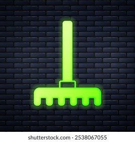 Glowing neon Garden rake icon isolated on brick wall background. Tool for horticulture, agriculture, farming. Ground cultivator. Housekeeping equipment.  Vector