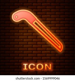 Glowing neon Garden saw icon isolated on brick wall background.  Vector Illustration