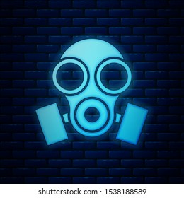 Glowing neon Gas mask icon isolated on brick wall background. Respirator sign.  Vector Illustration