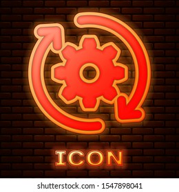 Glowing neon Gear and arrows as workflow concept icon isolated on brick wall background. Gear reload sign.  Vector Illustration