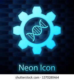 Glowing neon Genetic engineering icon isolated on brick wall background. DNA analysis, genetics testing, cloning, paternity testing. Vector Illustration