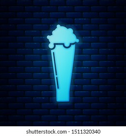 Glowing neon Glass of beer icon isolated on brick wall background.  Vector Illustration