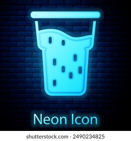 Glowing neon Glass of beer icon isolated on brick wall background.  Vector