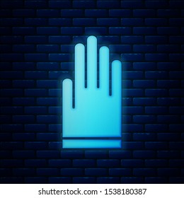 Glowing neon Gloves icon isolated on brick wall background. Extreme sport. Diving underwater equipment.  Vector Illustration