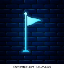 Glowing neon Golf flag icon isolated on brick wall background. Golf equipment or accessory.  Vector Illustration