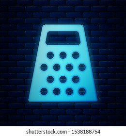 Glowing neon Grater icon isolated on brick wall background. Kitchen symbol. Cooking utensil. Cutlery sign.  Vector Illustration