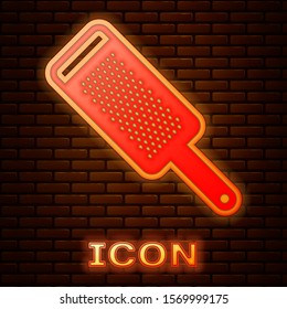 Glowing neon Grater icon isolated on brick wall background. Kitchen symbol. Cooking utensil. Cutlery sign.  Vector Illustration