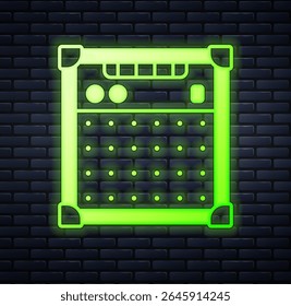 Glowing neon Guitar amplifier icon isolated on brick wall background. Musical instrument.  Vector