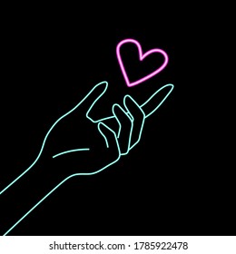 glowing neon hand with a heart