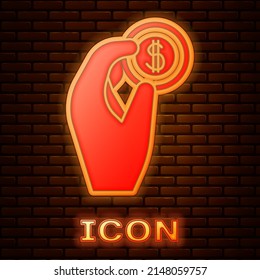 Glowing neon Hand holding coin money icon isolated on brick wall background. Dollar or USD symbol. Cash Banking currency sign. Vector Illustration