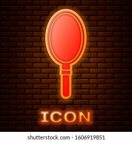 Glowing neon Hand mirror icon isolated on brick wall background.  Vector Illustration