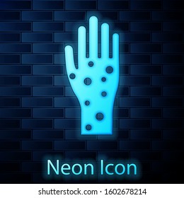 Glowing neon Hand with psoriasis or eczema icon isolated on brick wall background. Concept of human skin response to allergen or chronic body problem.  Vector Illustration