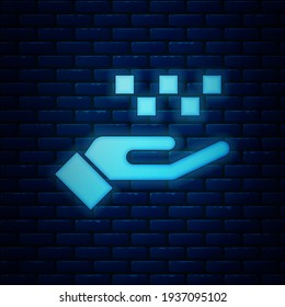 Glowing neon Hand with taxi icon isolated on brick wall background. Location symbol.  Vector
