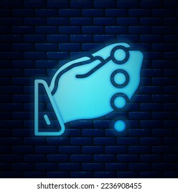 Glowing neon Hands in praying position with rosary icon isolated on brick wall background. Praying hand islam muslim religion spirituality religious.  Vector