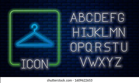 Glowing neon Hanger wardrobe icon isolated on brick wall background. Cloakroom icon. Clothes service symbol. Laundry hanger sign. Neon light alphabet. Vector Illustration