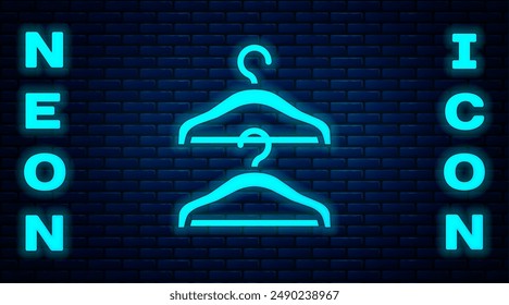 Glowing neon Hanger wardrobe icon isolated on brick wall background. Cloakroom icon. Clothes service symbol. Laundry hanger sign.  Vector