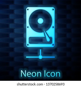 Glowing neon Hard disk drive on sharing network icon isolated on brick wall background. Vector Illustration