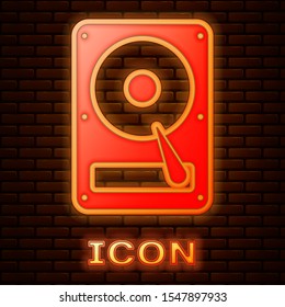 Glowing neon Hard disk drive HDD icon isolated on brick wall background.  Vector Illustration
