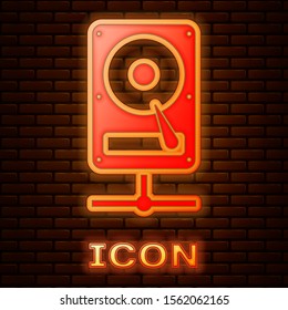 Glowing neon Hard disk drive on sharing network icon isolated on brick wall background.  Vector Illustration