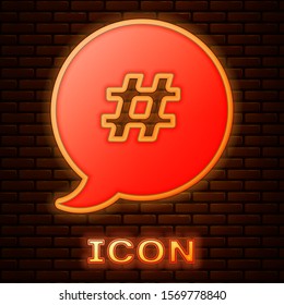 Glowing neon Hashtag speech bubble icon isolated on brick wall background. Concept of number sign, social media marketing, micro blogging.  Vector Illustration