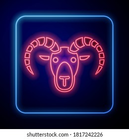 Glowing neon Head of goat or ram icon isolated on blue background. Mountain sheep. Animal symbol.  Vector