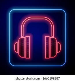 Glowing neon Headphones icon isolated on blue background. Support customer service, hotline, call center, faq, maintenance.  Vector Illustration