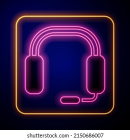 Glowing neon Headphones icon isolated on black background. Earphones. Concept for listening to music, service, communication and operator.  Vector