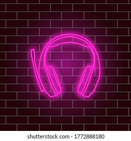 Glowing neon headphones. Pink light. Vector illustration.