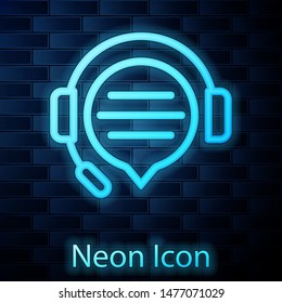Glowing neon Headphones with speech bubble chat icon isolated on brick wall background. Support customer service, hotline, call center, faq, maintenance.  Vector Illustration