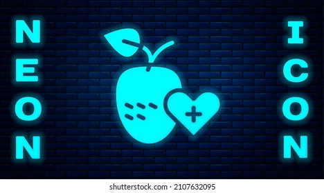 Glowing neon Healthy fruit icon isolated on brick wall background.  Vector
