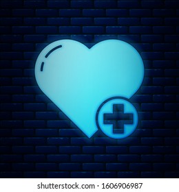 Glowing neon Heart icon isolated on brick wall background. Romantic symbol linked, join, passion and wedding. Valentine day symbol.  Vector Illustration