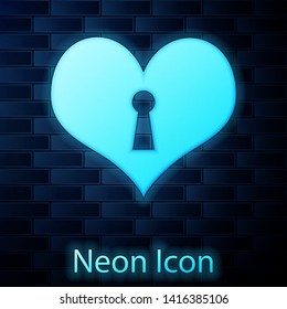Glowing neon Heart with keyhole icon isolated on brick wall background. Locked Heart. Love symbol and keyhole sign. Vector Illustration