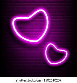 Glowing Neon Heart on Brick Wall. Love neon pink heart on brick wall. Pink glowing signboard.