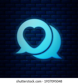 Glowing neon Heart in speech bubble icon isolated on brick wall background.  Vector