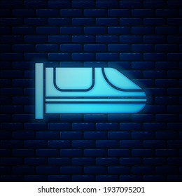 Glowing neon High-speed train icon isolated on brick wall background. Railroad travel and railway tourism. Subway or metro streamlined fast train transport.  Vector