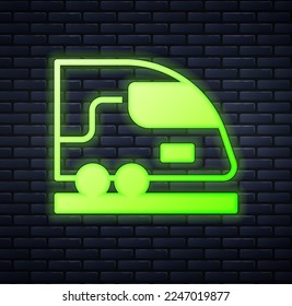 Glowing neon High-speed train icon isolated on brick wall background. Railroad travel and railway tourism. Subway or metro streamlined fast train transport.  Vector