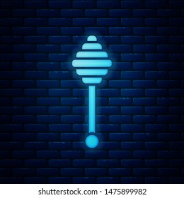 Glowing neon Honey dipper stick icon isolated on brick wall background. Honey ladle. Vector Illustration Glowing neon Honey dipper stick icon isolated on brick wall background. Honey ladle. Vector Illustration