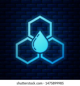 Glowing neon Honeycomb icon isolated on brick wall background. Honey cells symbol. Sweet natural food.  Vector Illustration