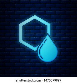 Glowing neon Honeycomb icon isolated on brick wall background. Honey cells symbol. Sweet natural food.  Vector Illustration