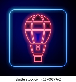 Glowing neon Hot air balloon icon isolated on blue background. Air transport for travel.  Vector Illustration