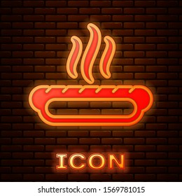 Glowing neon Hotdog sandwich with mustard icon isolated on brick wall background. Sausage icon. Fast food sign.  Vector Illustration