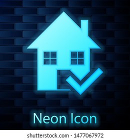 Glowing neon House with check mark icon isolated on brick wall background. Real estate agency or cottage town elite class.  Vector Illustration