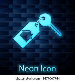 Glowing neon House with key icon isolated on brick wall background. The concept of the house turnkey.  Vector Illustration
