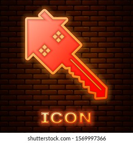 Glowing neon House with key icon isolated on brick wall background. The concept of the house turnkey.  Vector Illustration