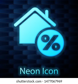 Glowing neon House with percant discount tag icon isolated on brick wall background. House percentage sign price. Real estate home. Credit percentage symbol.  Vector Illustration