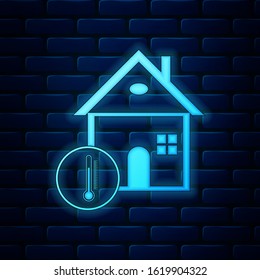 Glowing neon House temperature icon isolated on brick wall background. Thermometer icon.  Vector Illustration